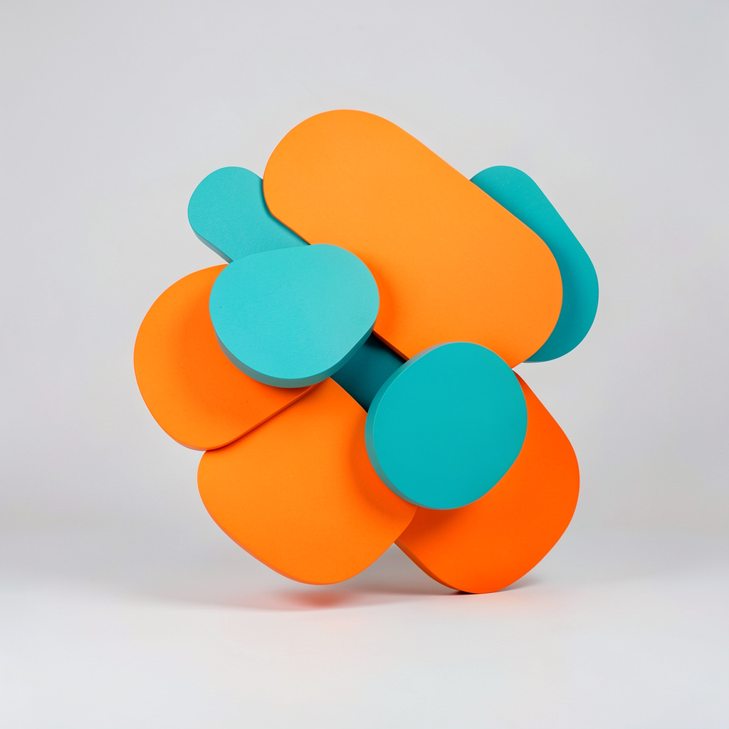 A clean studio photograph on a seamless light grey backdrop featuring abstract rounded geometric shapes in vivid orange and teal, arranged in a playful overlapping composition with soft shadows.